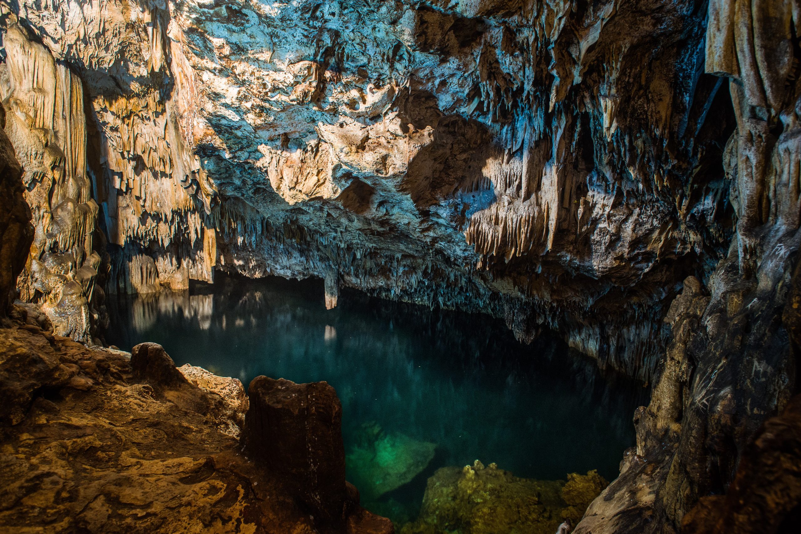 Explore stunning limestone caves featuring impressive stalactites and stalagmites, and enjoy a refreshing swim in the crystal-clear freshwater pools.