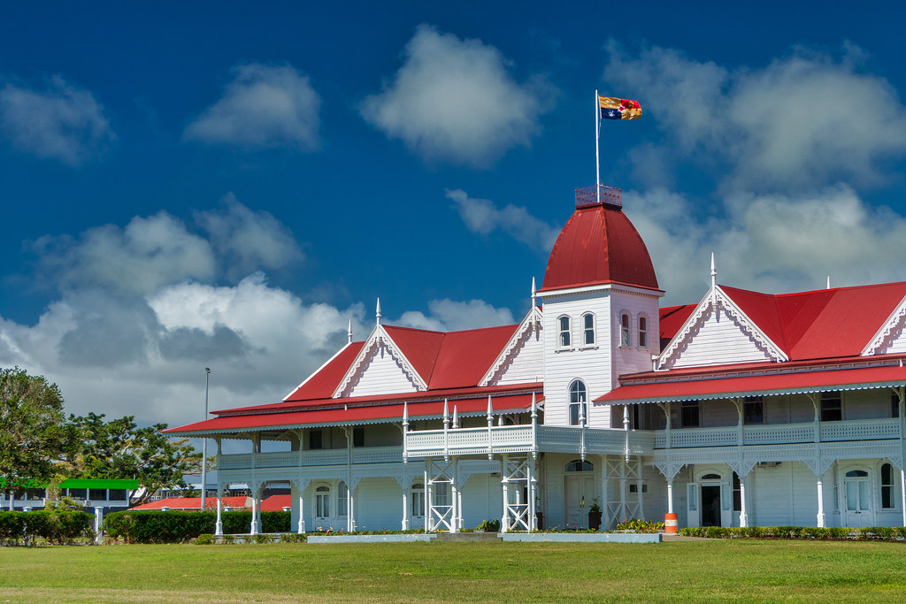 Visit the official residence of the King of Tonga, a beautiful wooden structure set against a backdrop of lush gardens